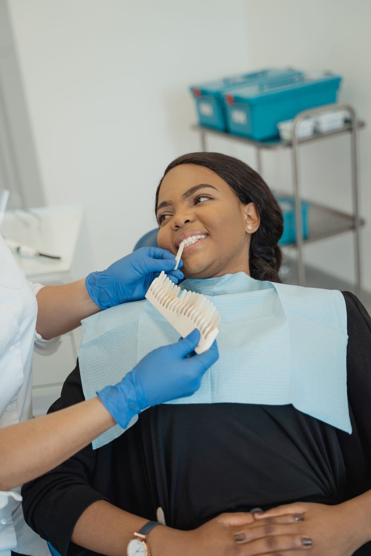 A dentist reassuring a patient during a visit